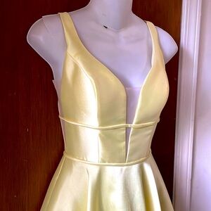 La femme plunge ballgown in pale yellow